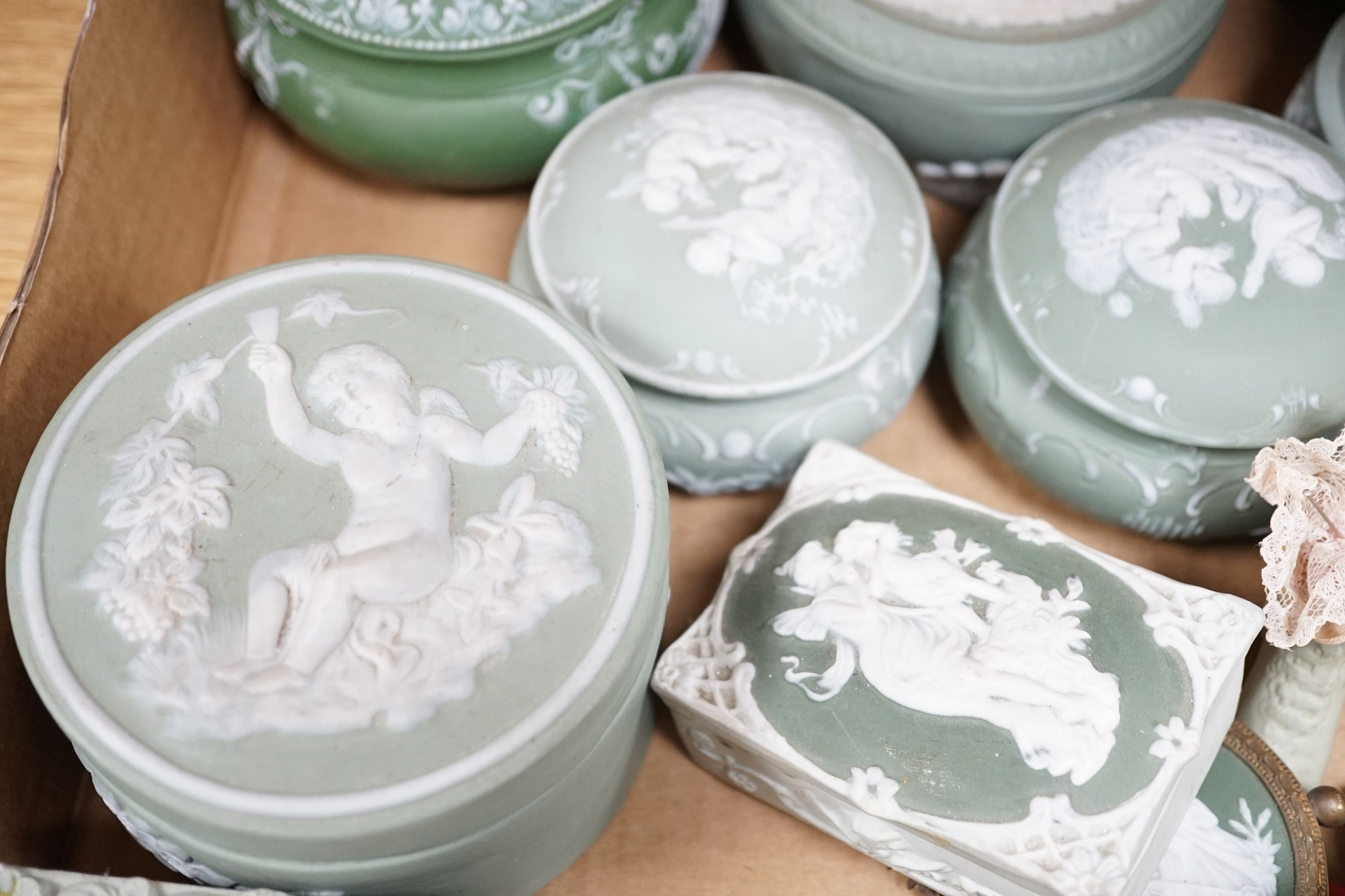 A collection of French bisque boxes and vases.